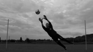 A goalkeeper in action during a football match