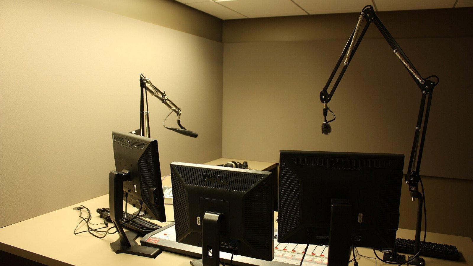 A microphone and mixing desk in a radio studio