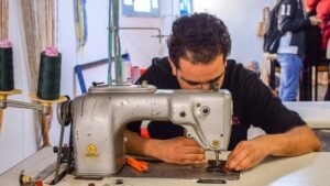 A tailor at work repairing and altering clothing