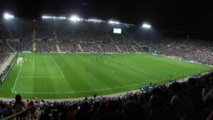 Supporters filling a stadium on a European match night