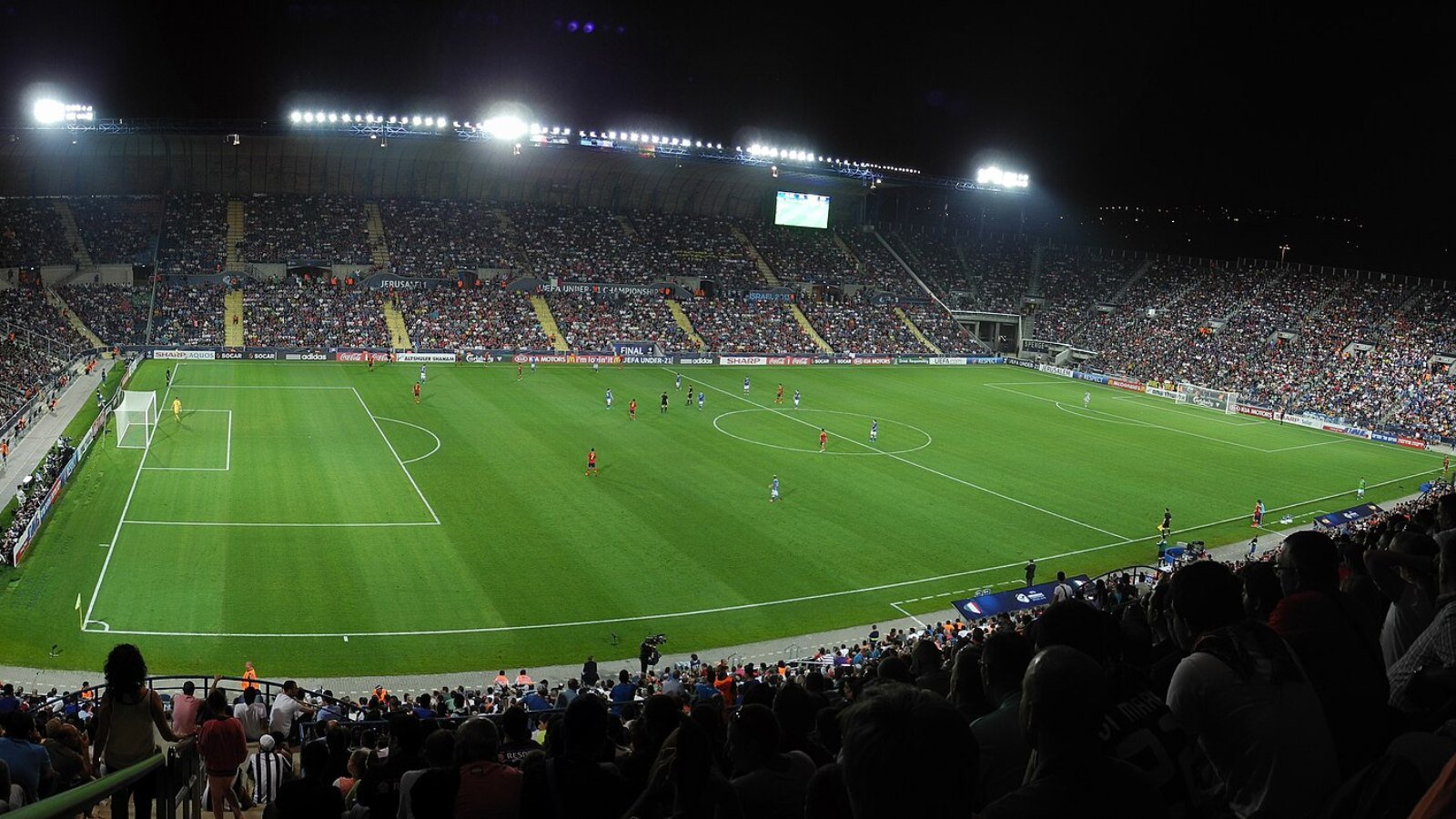 Supporters filling a stadium on a European match night