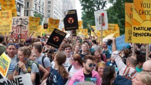 Demonstrators marching at a climate protest