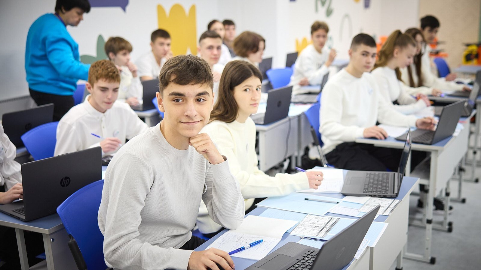 A learner studying at a laptop
