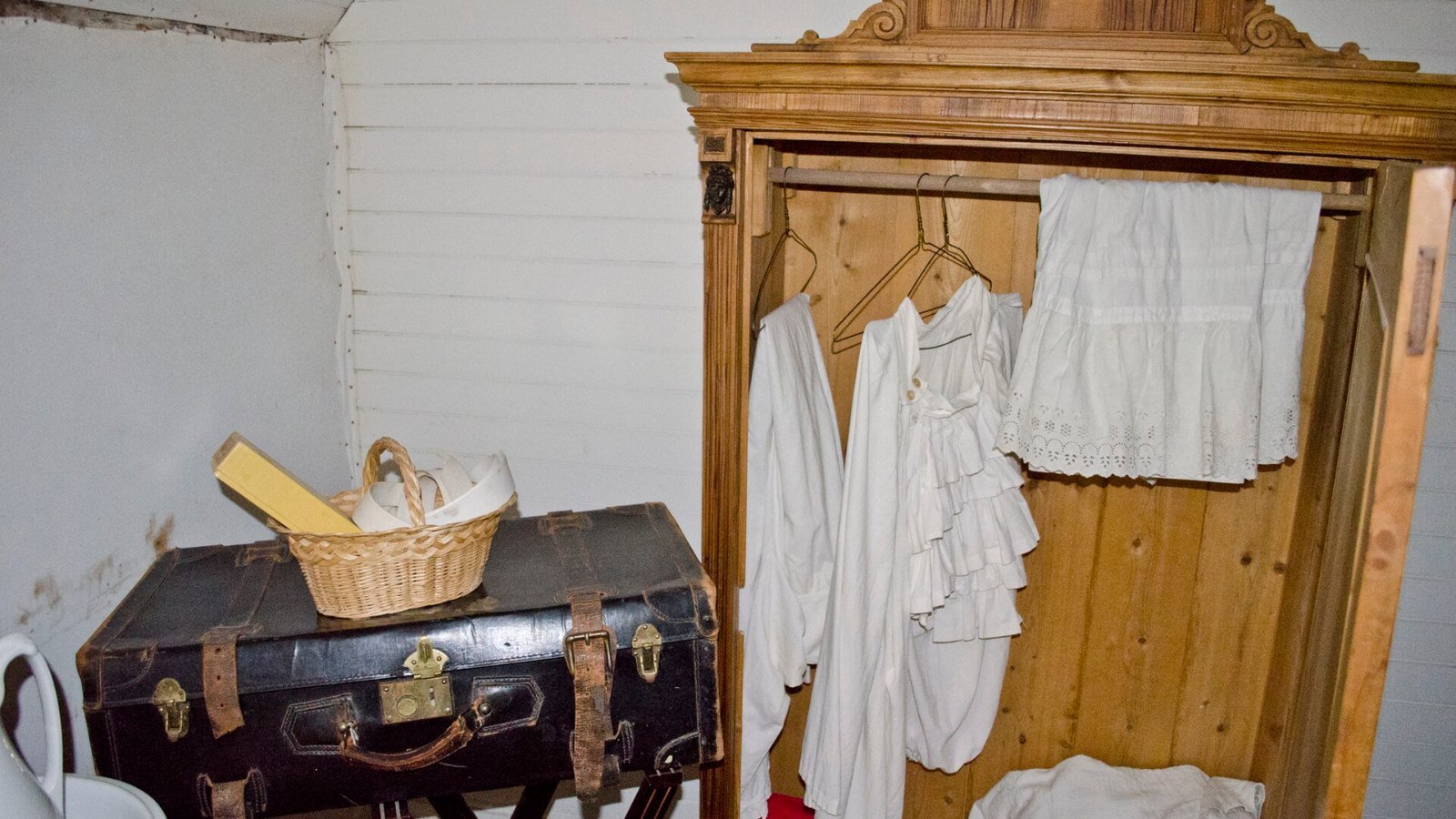A pared back wardrobe of hanging clothes