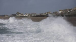 Storm driven waves breaking against a coastal defence