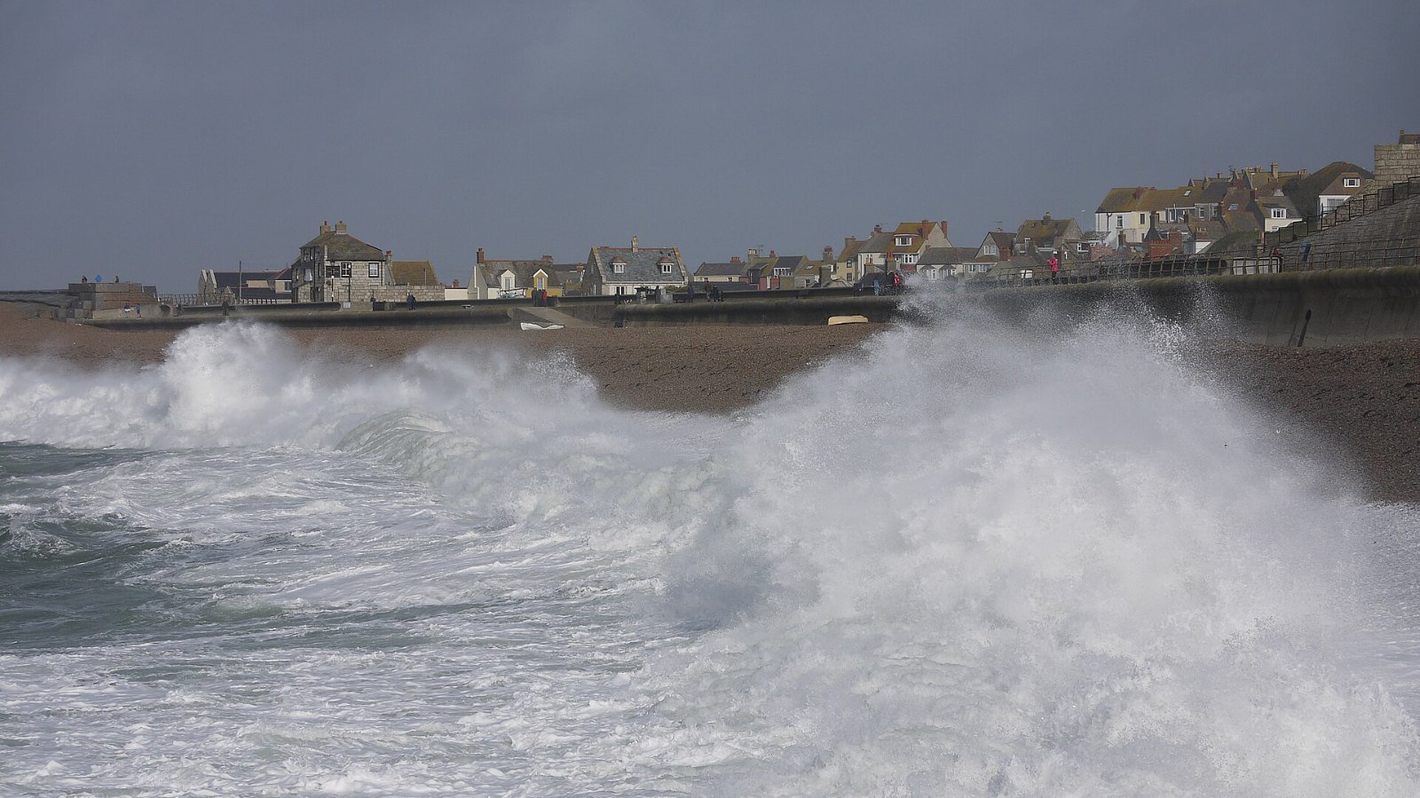 Storm driven waves breaking against a coastal defence