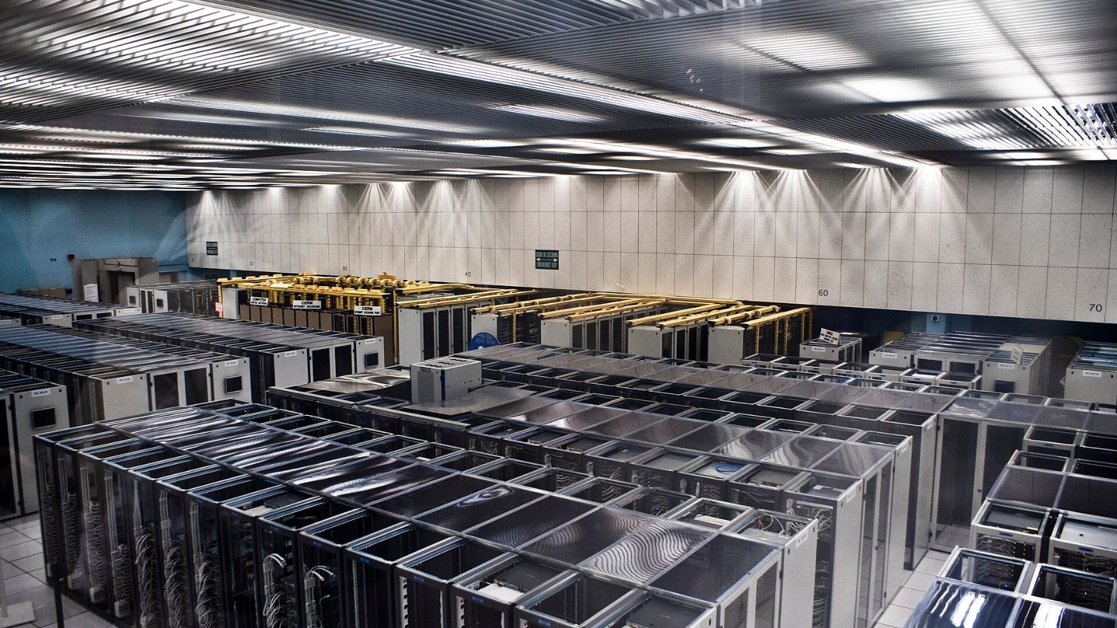 Rows of servers in a data centre supporting artificial intelligence systems