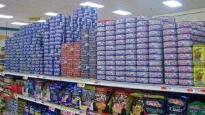 Packaged foods stacked on supermarket shelves