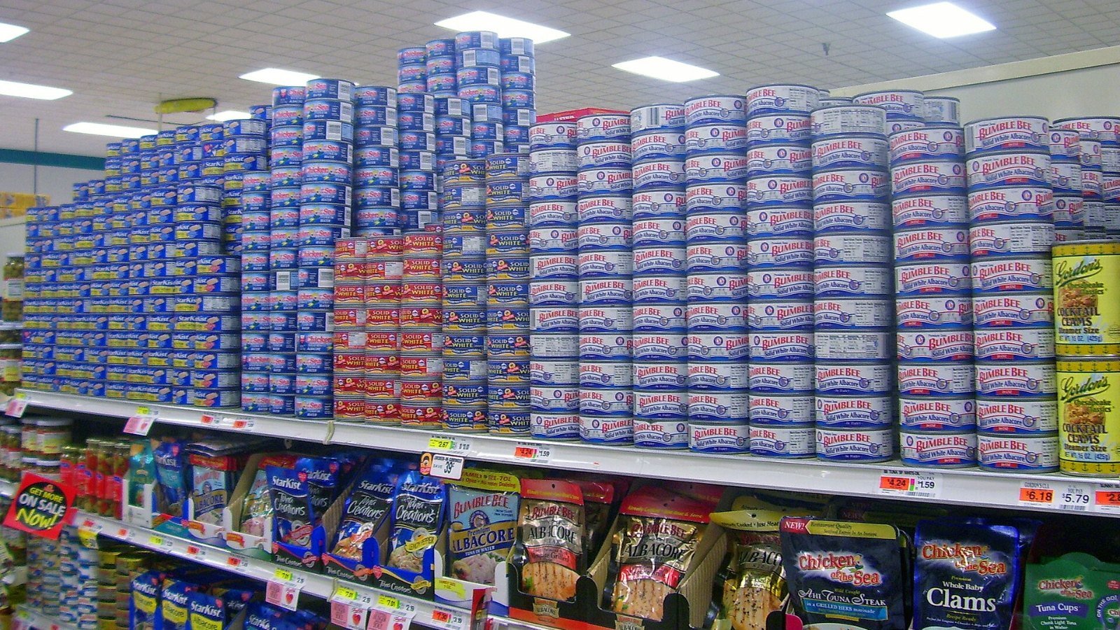 Packaged foods stacked on supermarket shelves